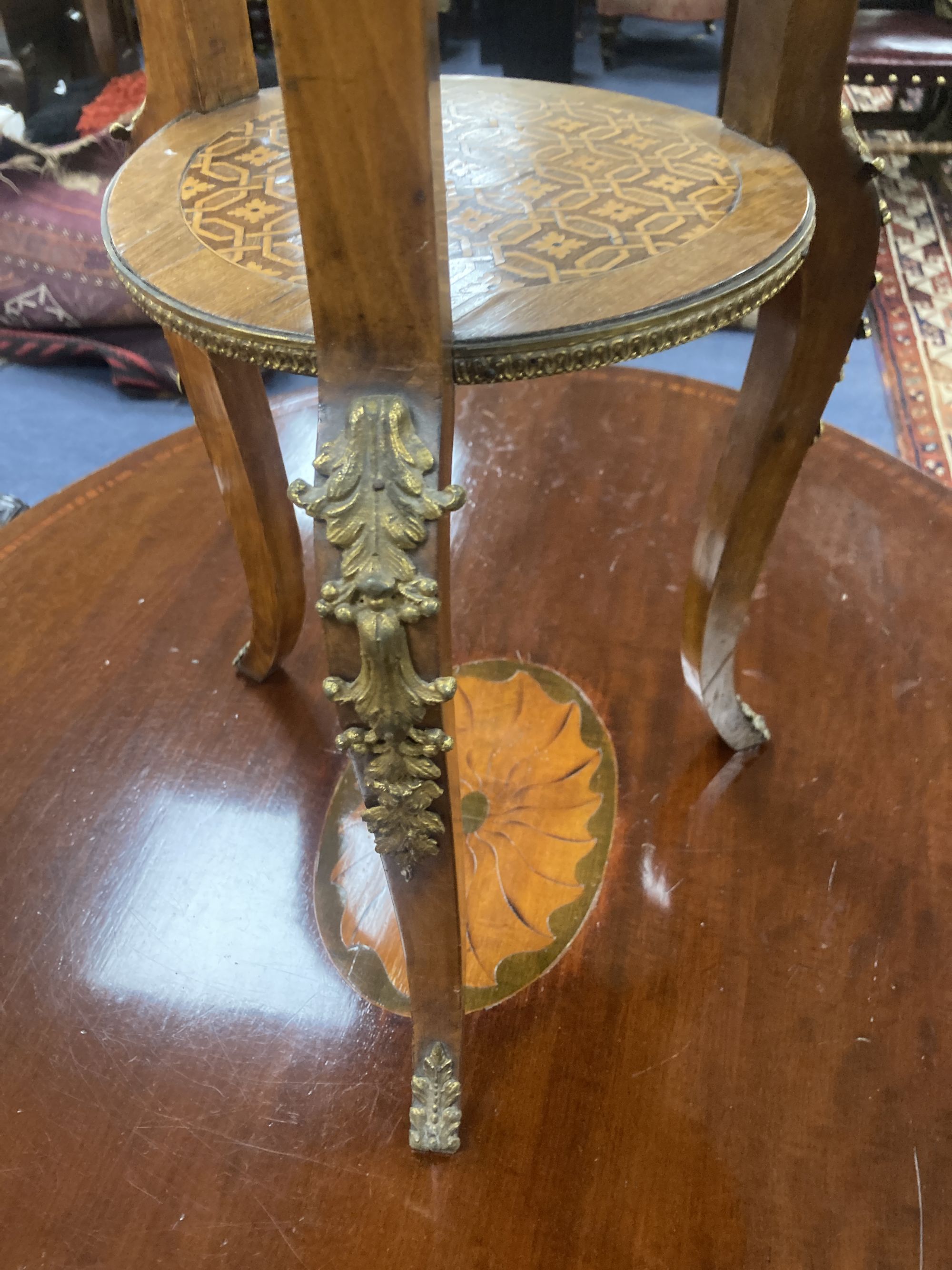 A Louis XVI style inlaid mahogany and ormolu mounted two tier gueridon, diameter 45cm, height 76cm